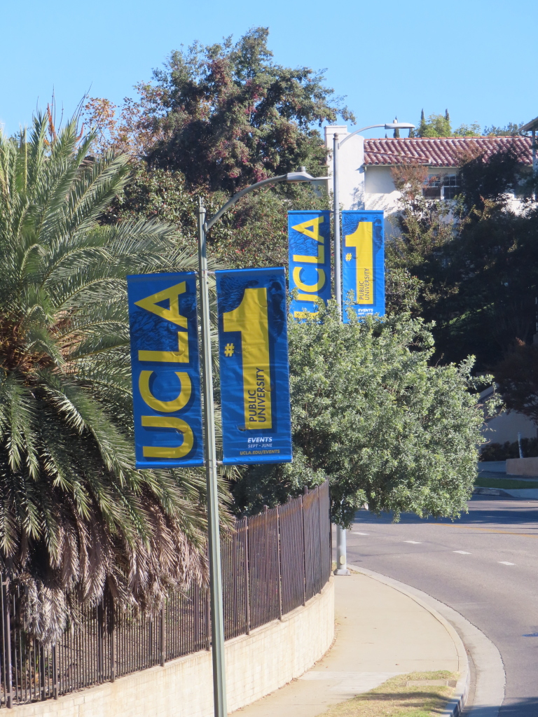 UCLA blue and yellow branded light pole banners